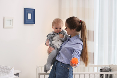 Teen nanny with cute little baby at home