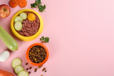 Photo of Pet food and natural ingredients on pink background, flat lay. Space for text