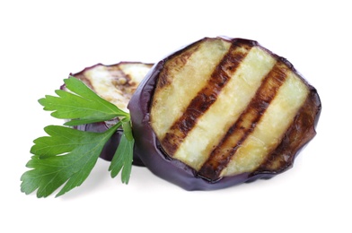 Photo of Delicious grilled eggplant slices and parsley on white background