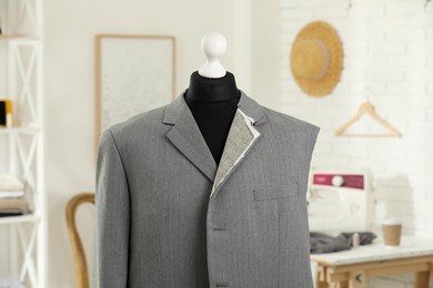 Mannequin with unfinished jacket in tailor shop