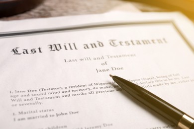 Last Will and Testament with pen on table, closeup