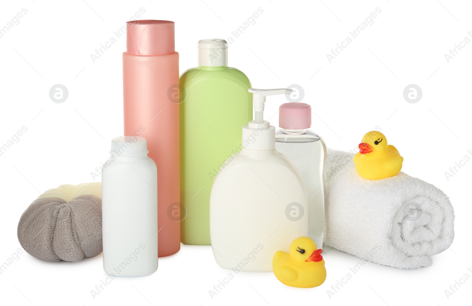 Photo of Bottles of baby cosmetic products, towel, bath sponge and rubber ducks on white background