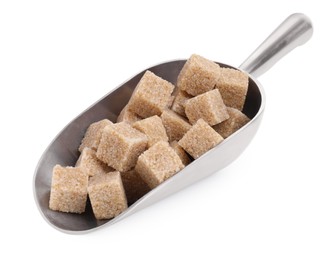 Photo of Brown sugar cubes in metal scoop isolated on white