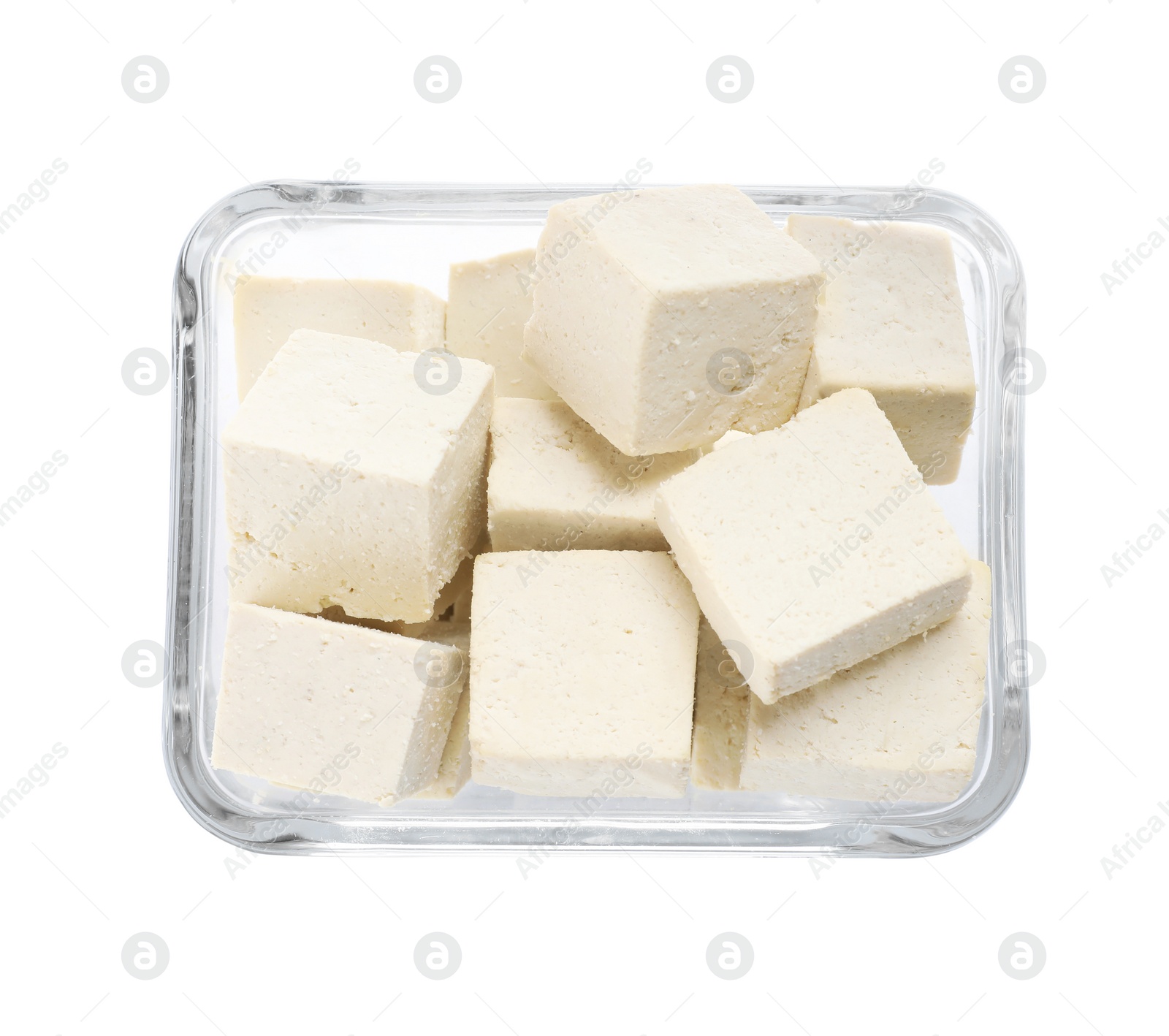 Photo of Glass bowl with delicious tofu isolated on white, top view