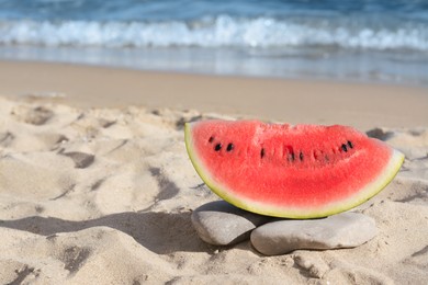 Photo of Slice of fresh juicy watermelon near sea, space for text