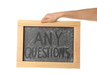 Woman holding blackboard with phrase ANY QUESTIONS on white background, closeup