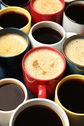 Photo of Many cups of different coffee drinks on table