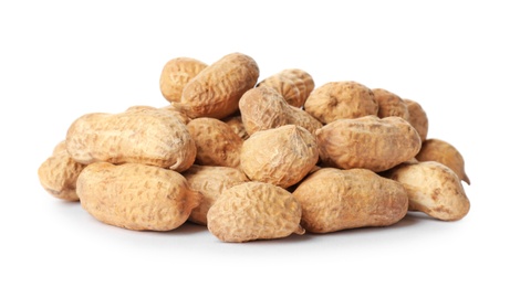 Raw peanuts in pods on white background