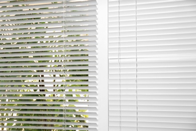 Window with white horizontal blinds as background