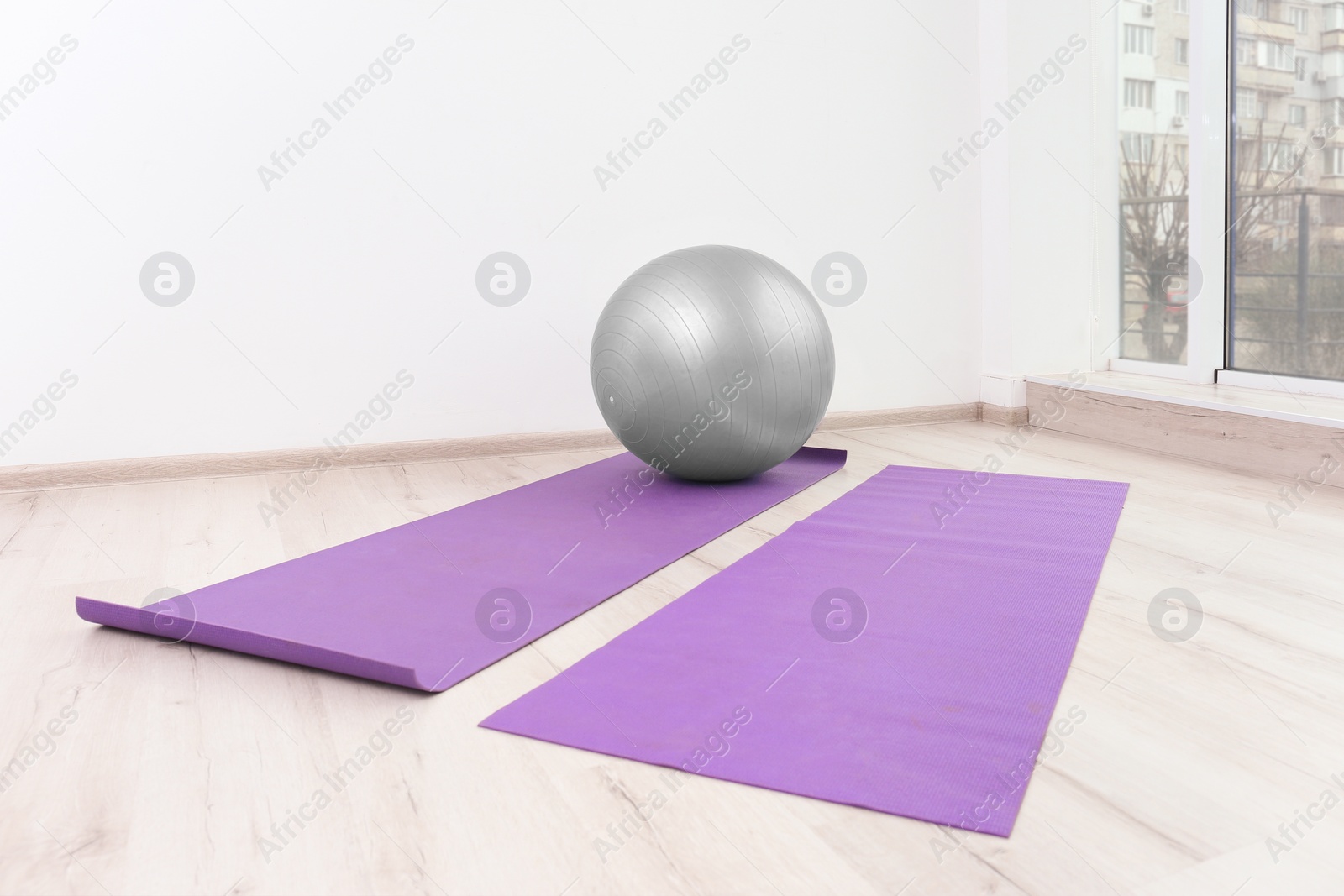 Photo of Ball and yoga mats in physiotherapy gym