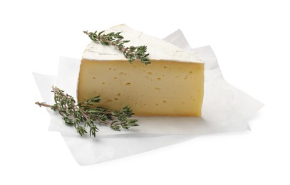 Photo of Piece of tasty camembert cheese and thyme isolated on white