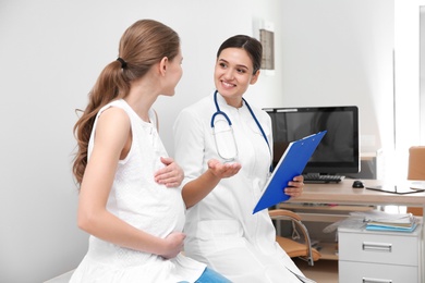 Pregnant woman having appointment at gynecologist office