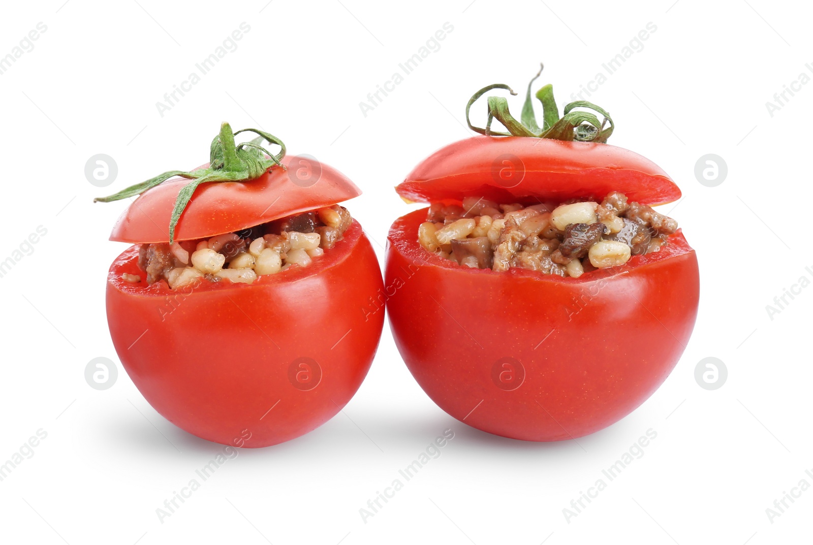 Photo of Delicious stuffed tomatoes with minced beef, bulgur and mushrooms isolated on white