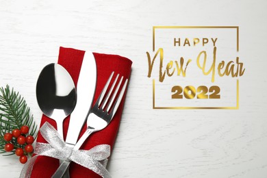 Image of Happy New 2022 Year! Cutlery set on white wooden table, top view.