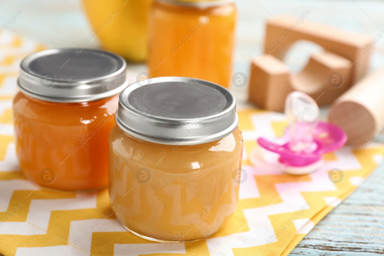 Photo of Jars with healthy baby food on table