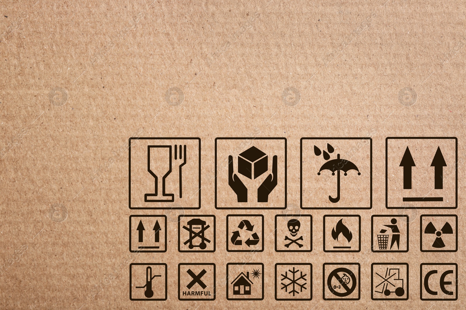 Image of Cardboard box with packaging symbols as background, closeup