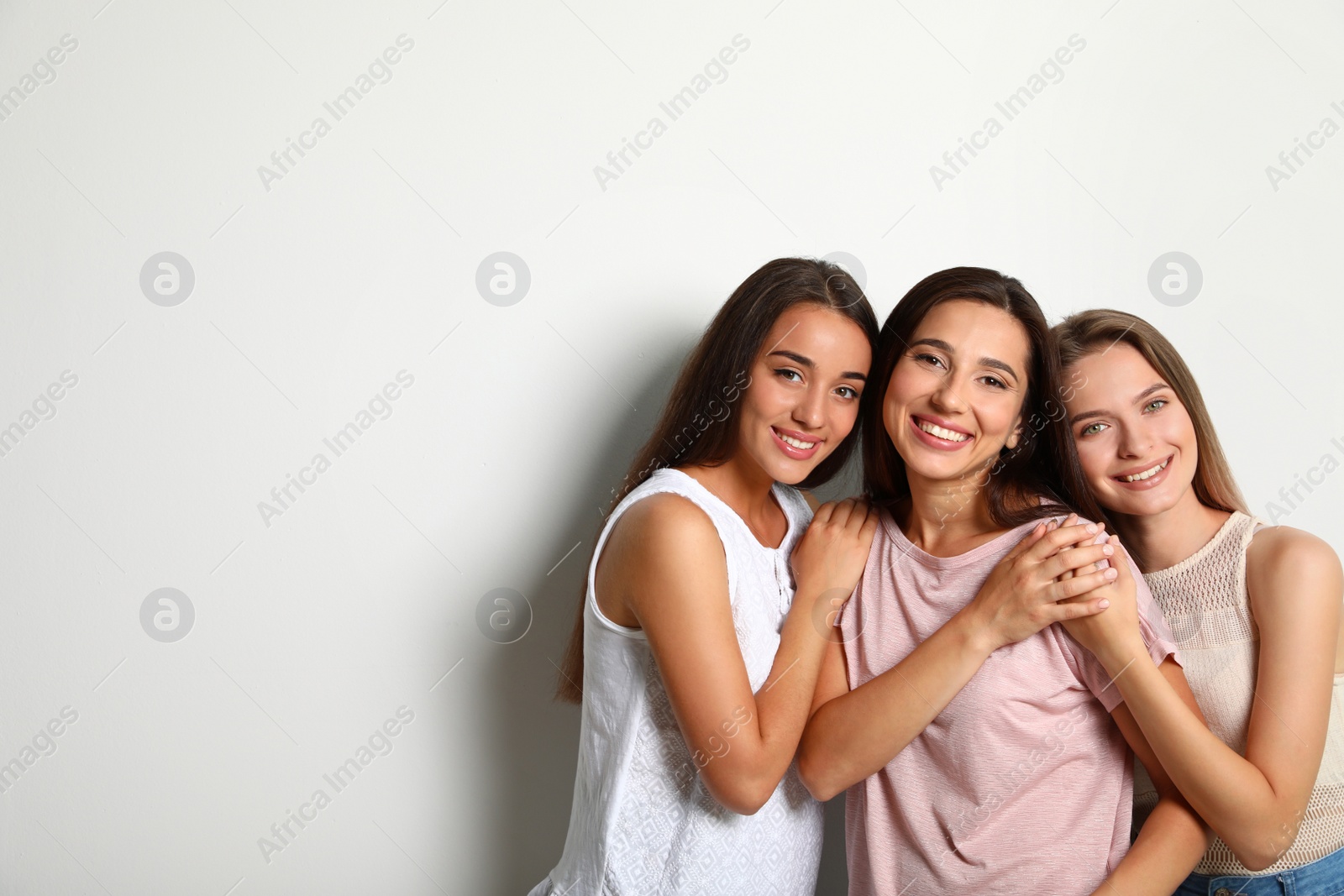 Photo of Happy women on white background, space for text. Girl power concept