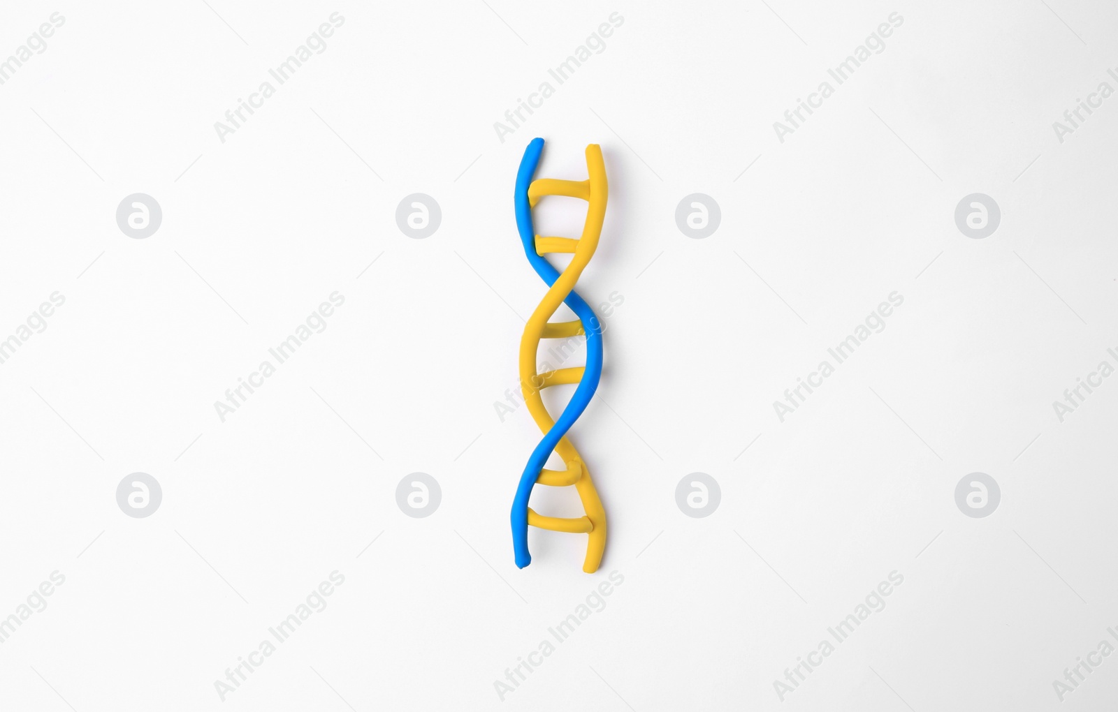 Photo of DNA molecule model made of colorful plasticine on white background, top view