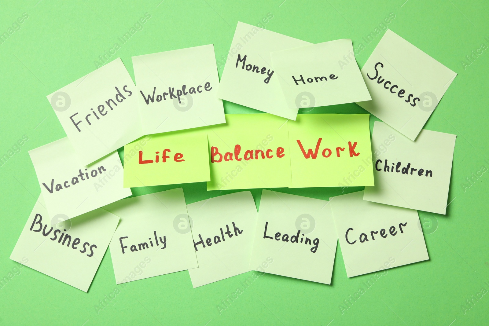 Photo of Sticky notes with words on green background. Life and work balance concept