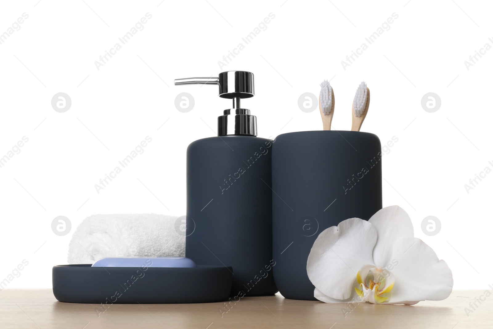 Photo of Bath accessories. Different personal care products and flower on wooden table against white background