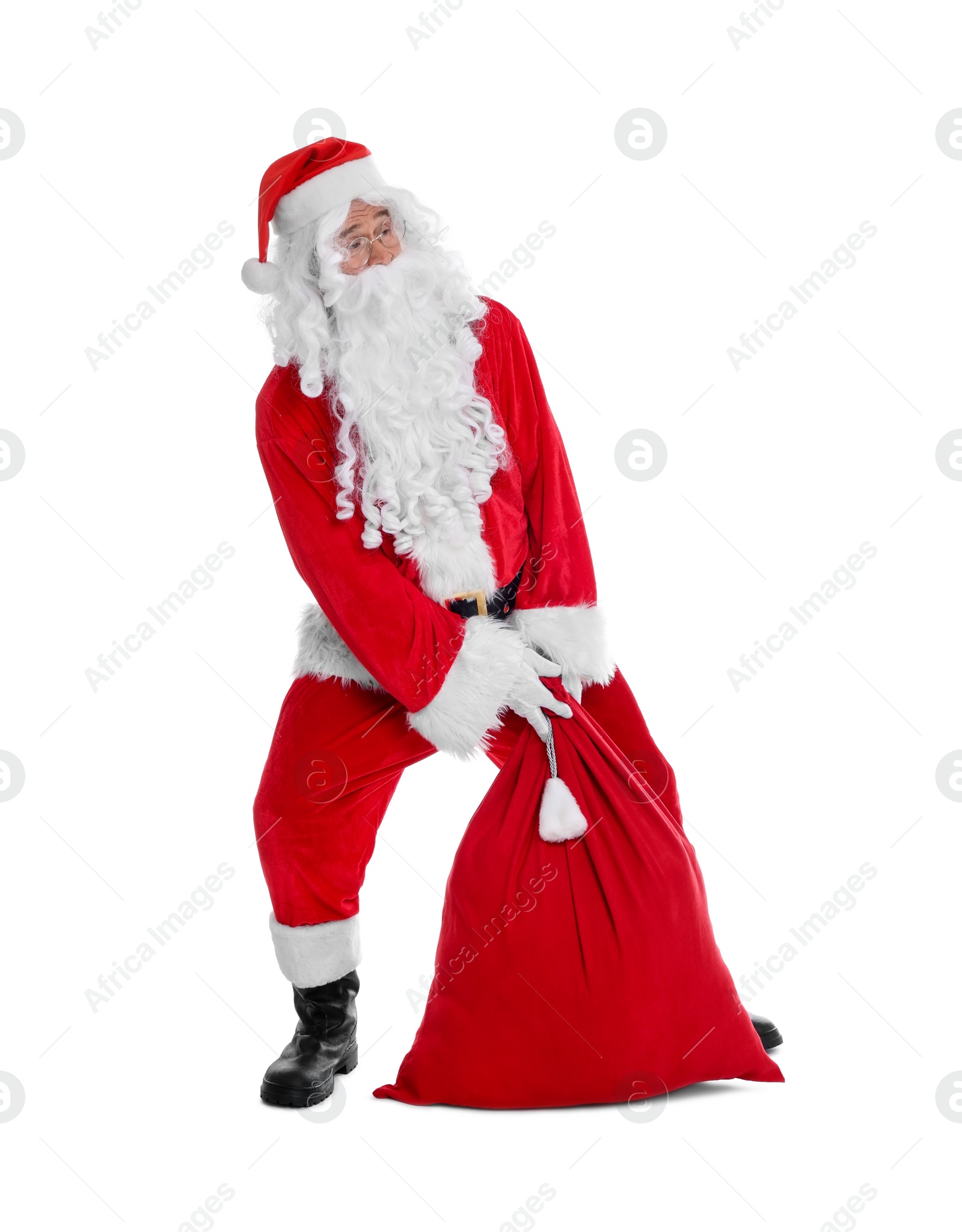 Photo of Man in Santa Claus costume with bag posing on white background