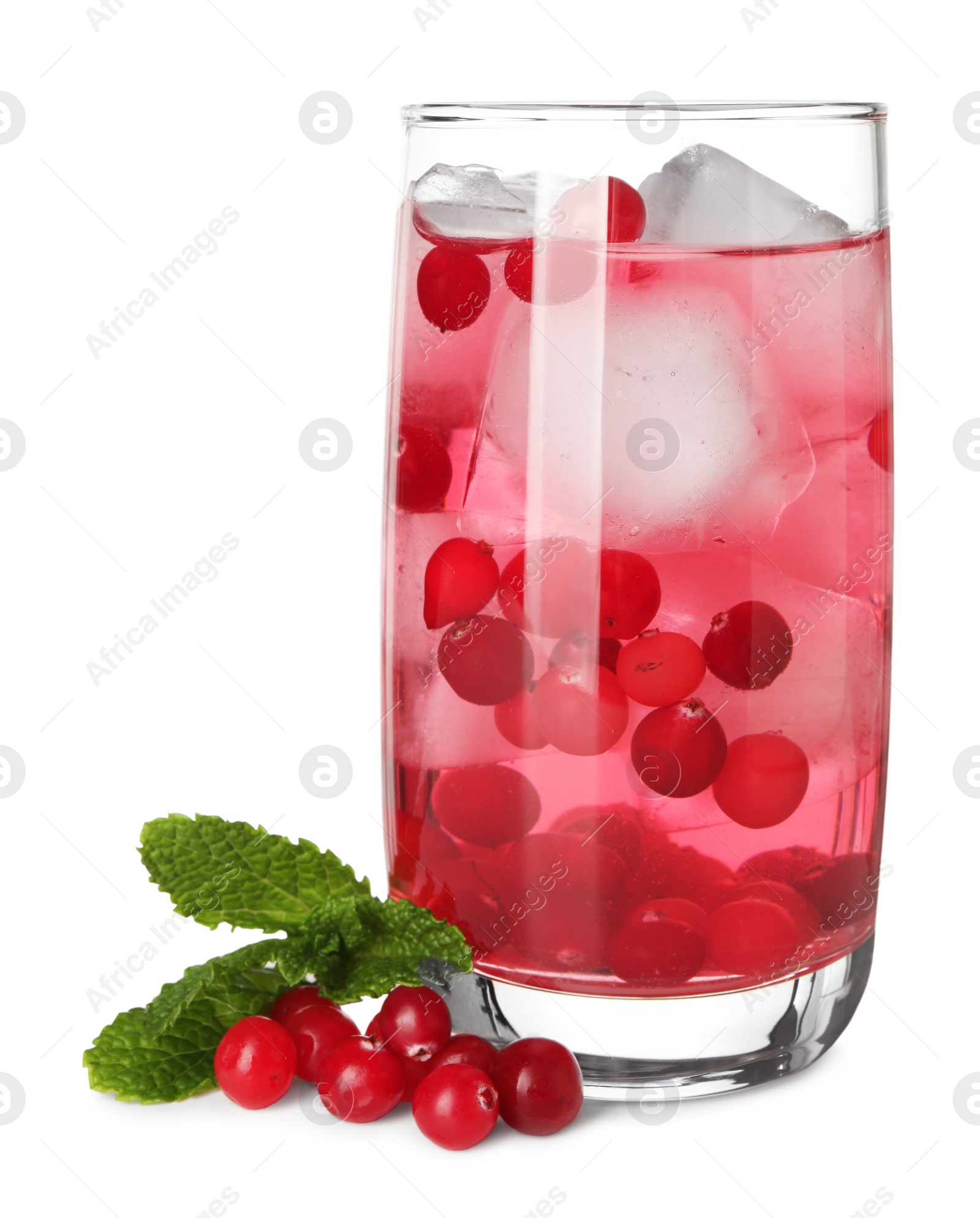 Photo of Tasty cranberry cocktail with ice cubes and mint in glass isolated on white