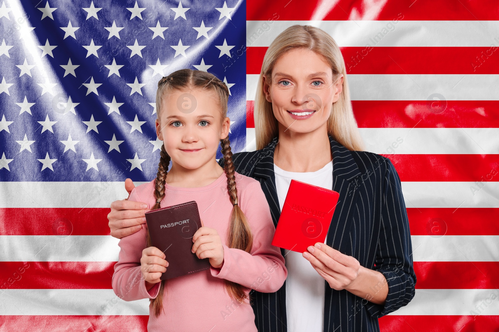 Image of Immigration. Happy woman and her daughter with passports against national flag of United States
