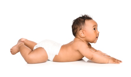 Adorable African-American baby in diaper on white background