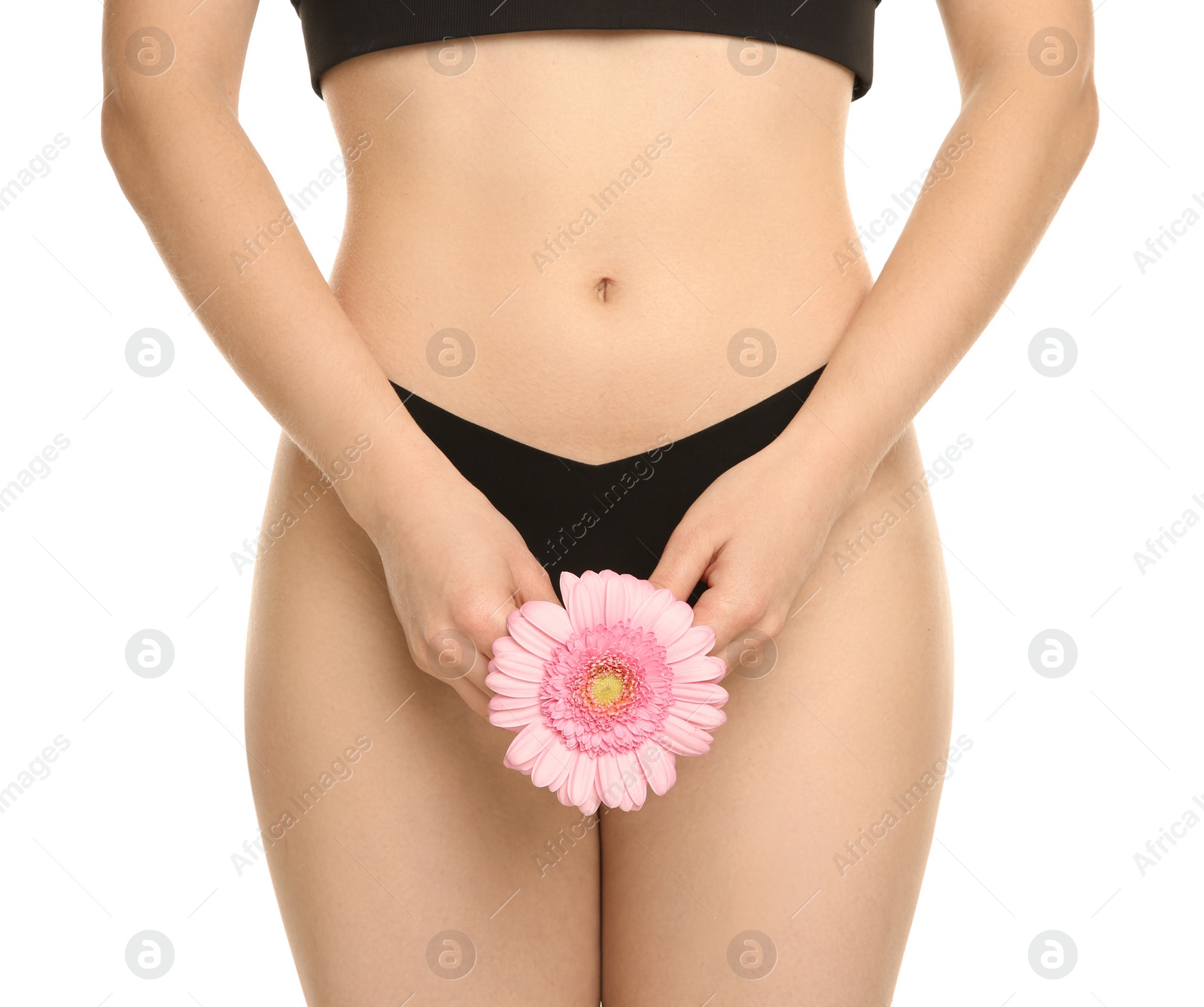 Photo of Gynecology. Woman in underwear with gerbera flower on white background, closeup