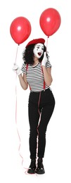 Photo of Funny mime with balloons posing on white background