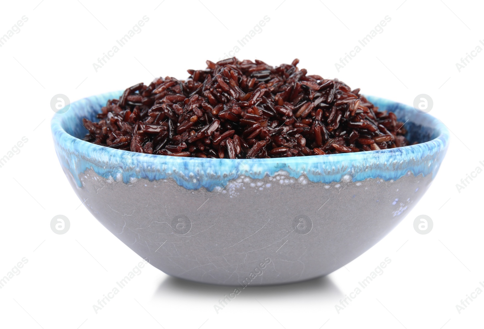 Photo of Bowl with delicious cooked brown rice on white background