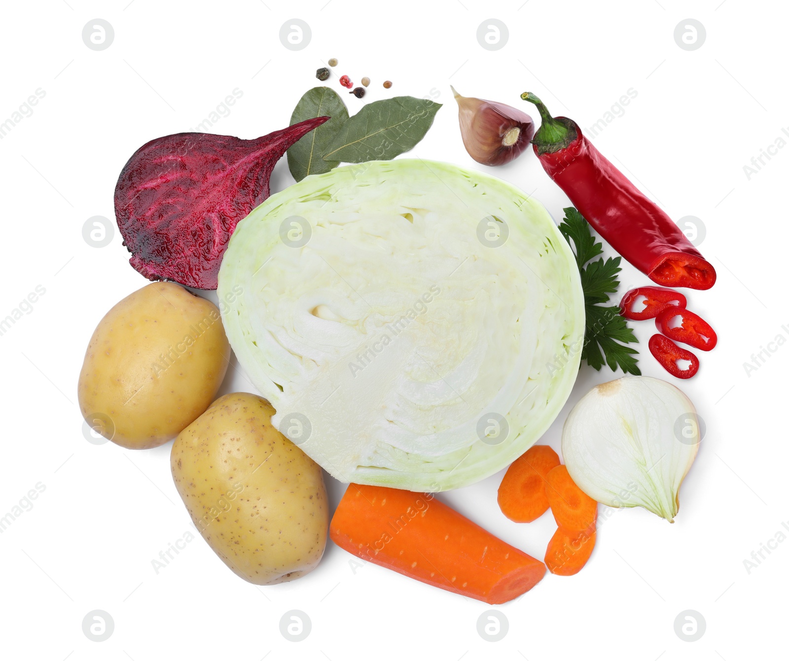 Photo of Ingredients for traditional borscht on white background, top view