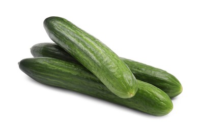 Photo of Many long fresh cucumbers isolated on white