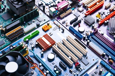 Many computer motherboards on table. Electronic device