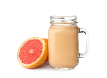 Photo of Mason jar with healthy detox smoothie and grapefruit on white background