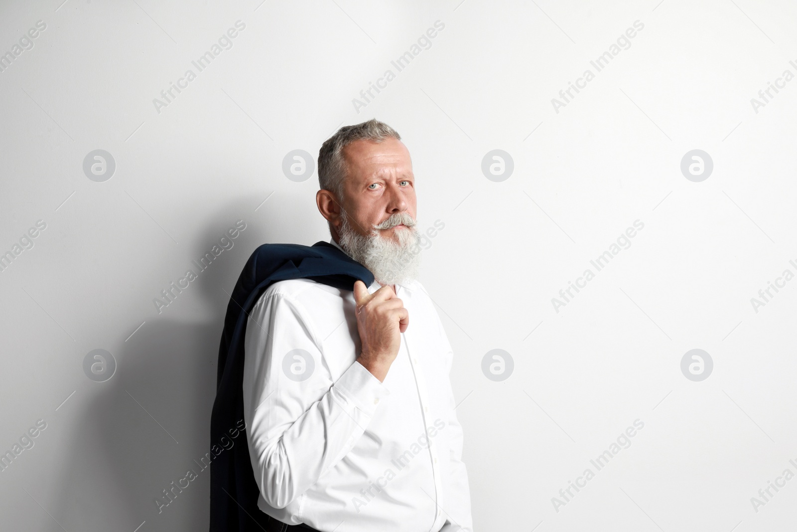 Photo of Portrait of handsome senior man on white background