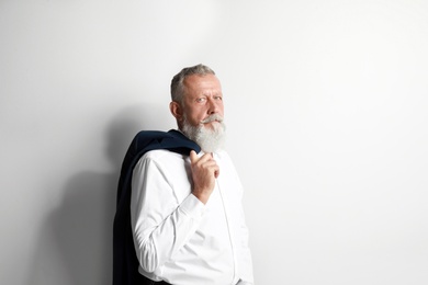 Portrait of handsome senior man on white background