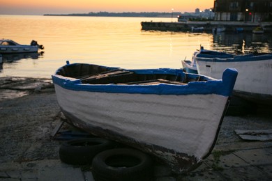 Photo of Beautiful view of river with moored boats at sunset