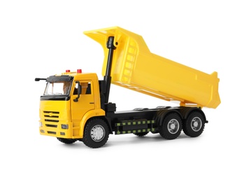 Photo of Yellow toy tipper truck isolated on white