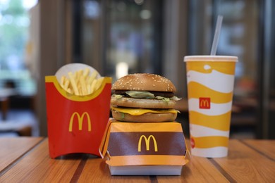 Photo of Lviv, Ukraine - October 9, 2023: McDonald's menu on wooden table in restaurant