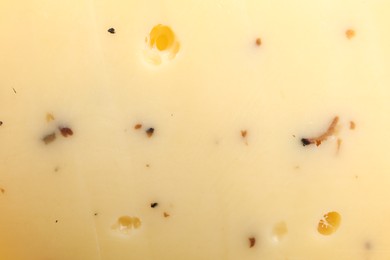 Photo of Delicious truffle cheese as background, closeup view
