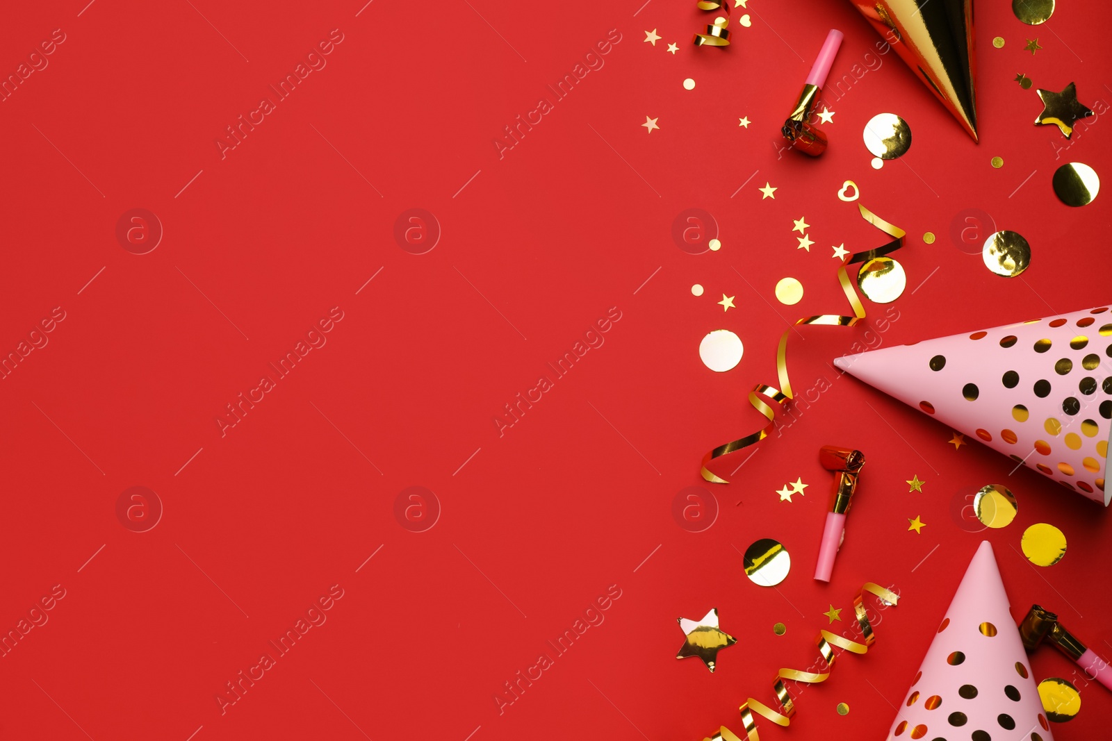 Photo of Flat lay composition with party items on red background, space for text