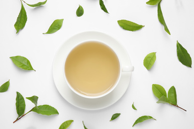 Flat lay composition with green tea on white background