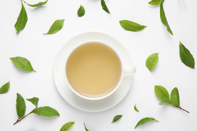 Photo of Flat lay composition with green tea on white background