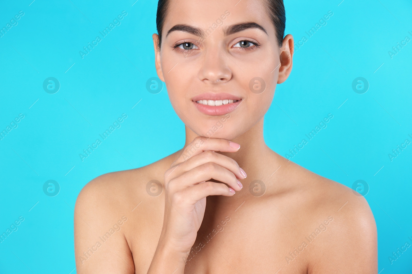 Photo of Portrait of beautiful young woman on color background. Lips contouring, skin care and cosmetic surgery concept