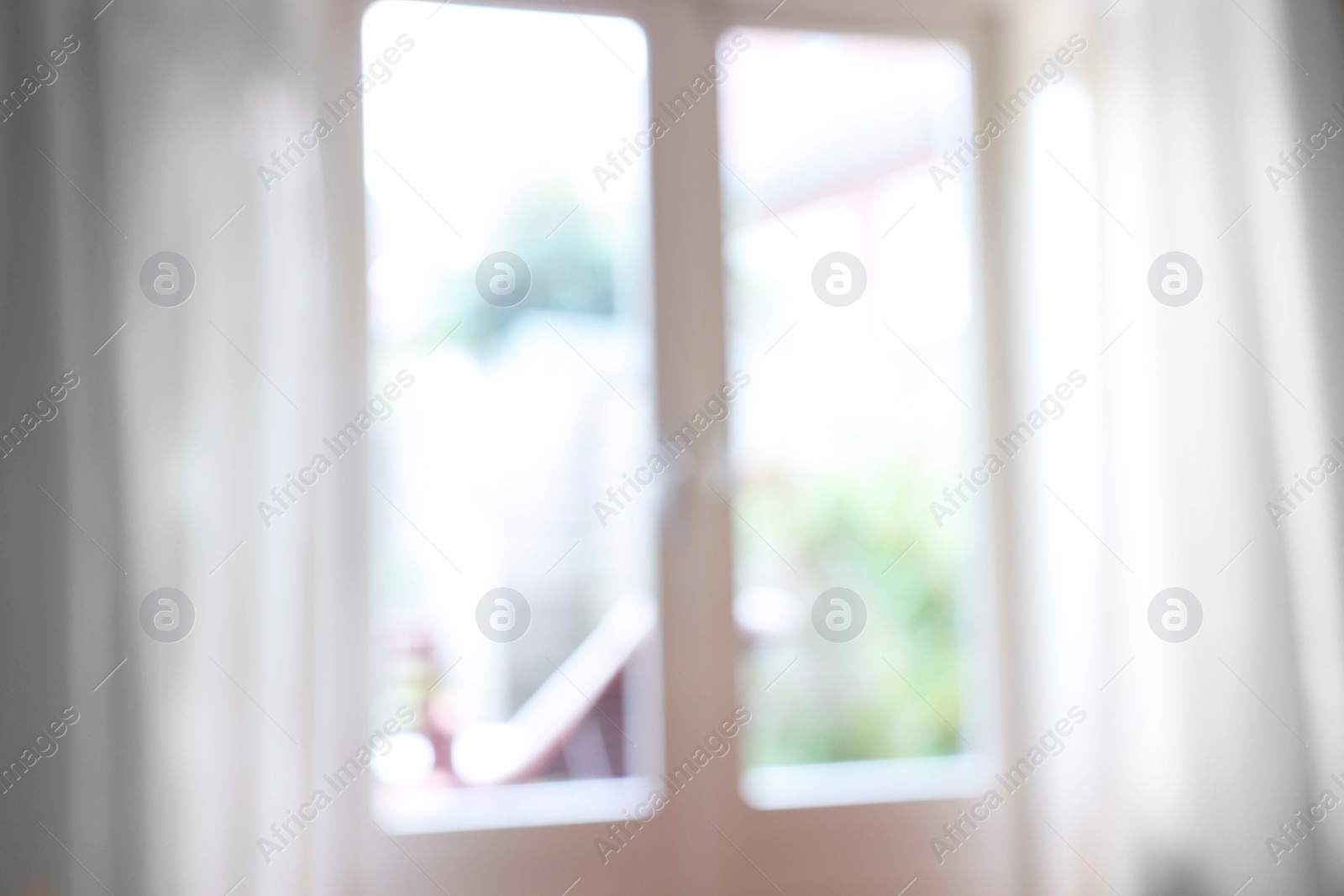 Photo of Blurred view of glass door at home