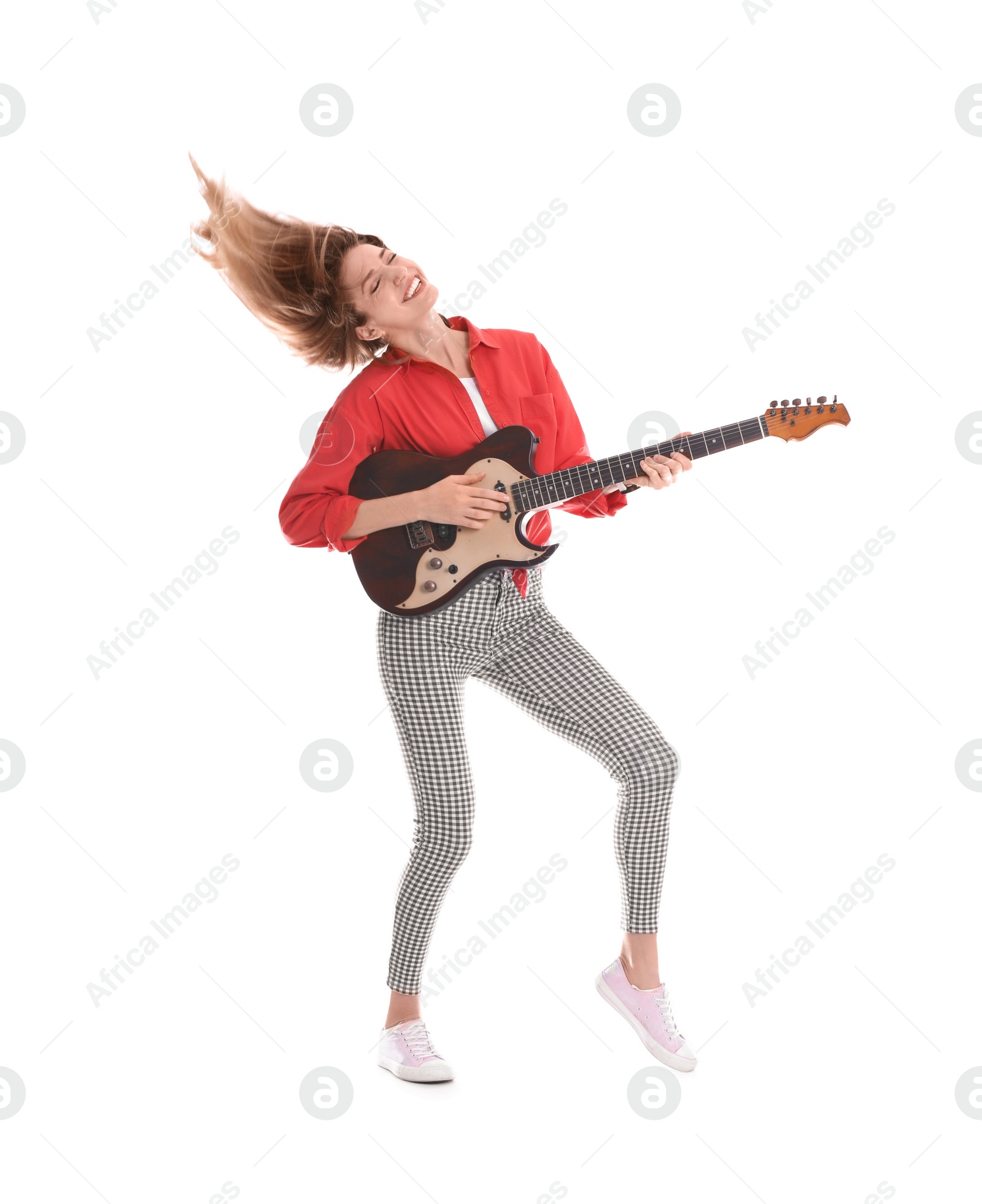 Photo of Young woman playing electric guitar on white background