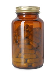 Photo of Vitamin pills in bottle isolated on white