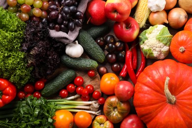 Different fresh ripe vegetables and fruits on wooden table, flat lay