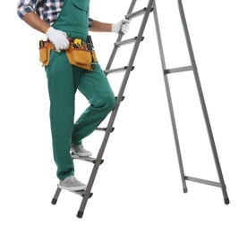 Photo of Professional builder climbing up metal ladder on white background, closeup